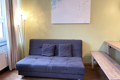 Ferienwohnung Style: Wohnzimmer Schlafcouch